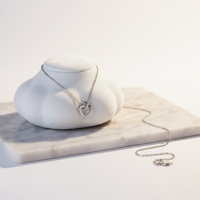 Forever Love Necklace - delicate silver heart pendant on marble surface
